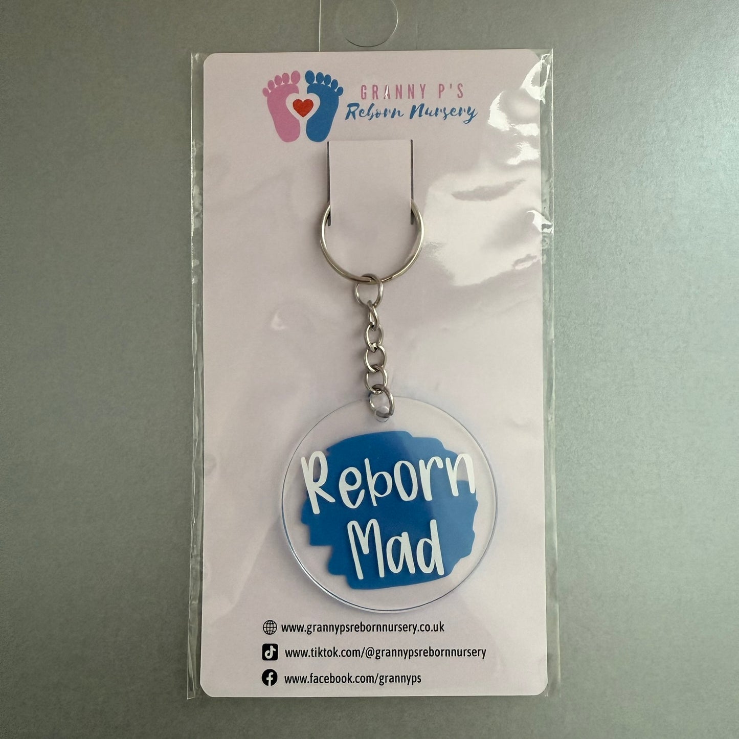 Reborn Collectors Keyring - Blue Reborn Mad