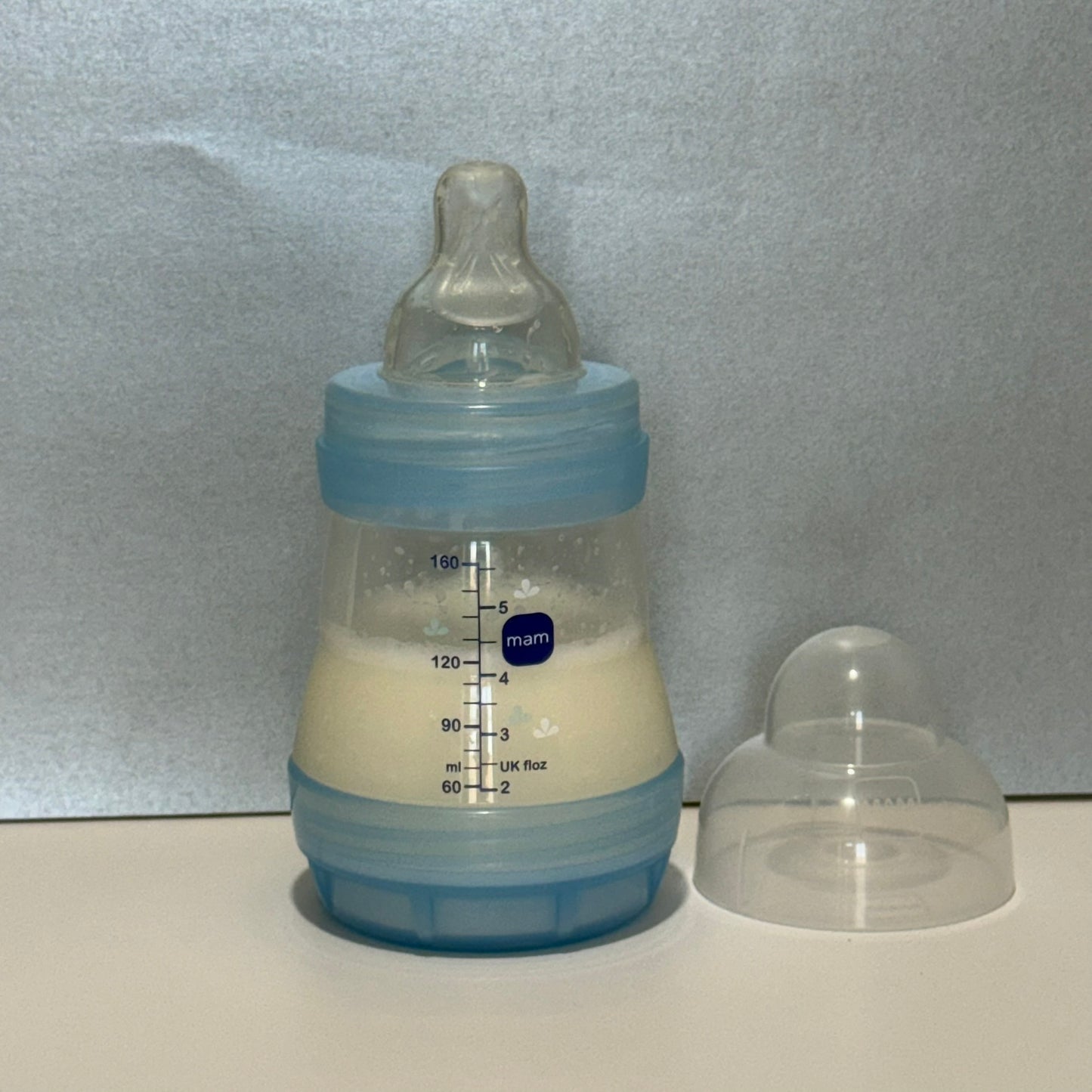 MAM Transparent Blue Dinosaur Reborn Fake Milk Bottle 5oz