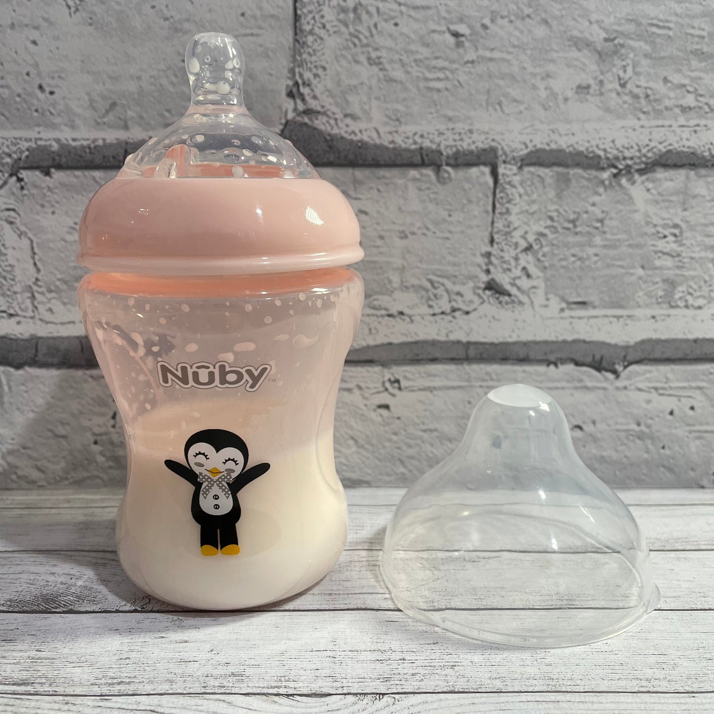 Nuby Pink Penguin Reborn Fake Milk Bottle 9oz