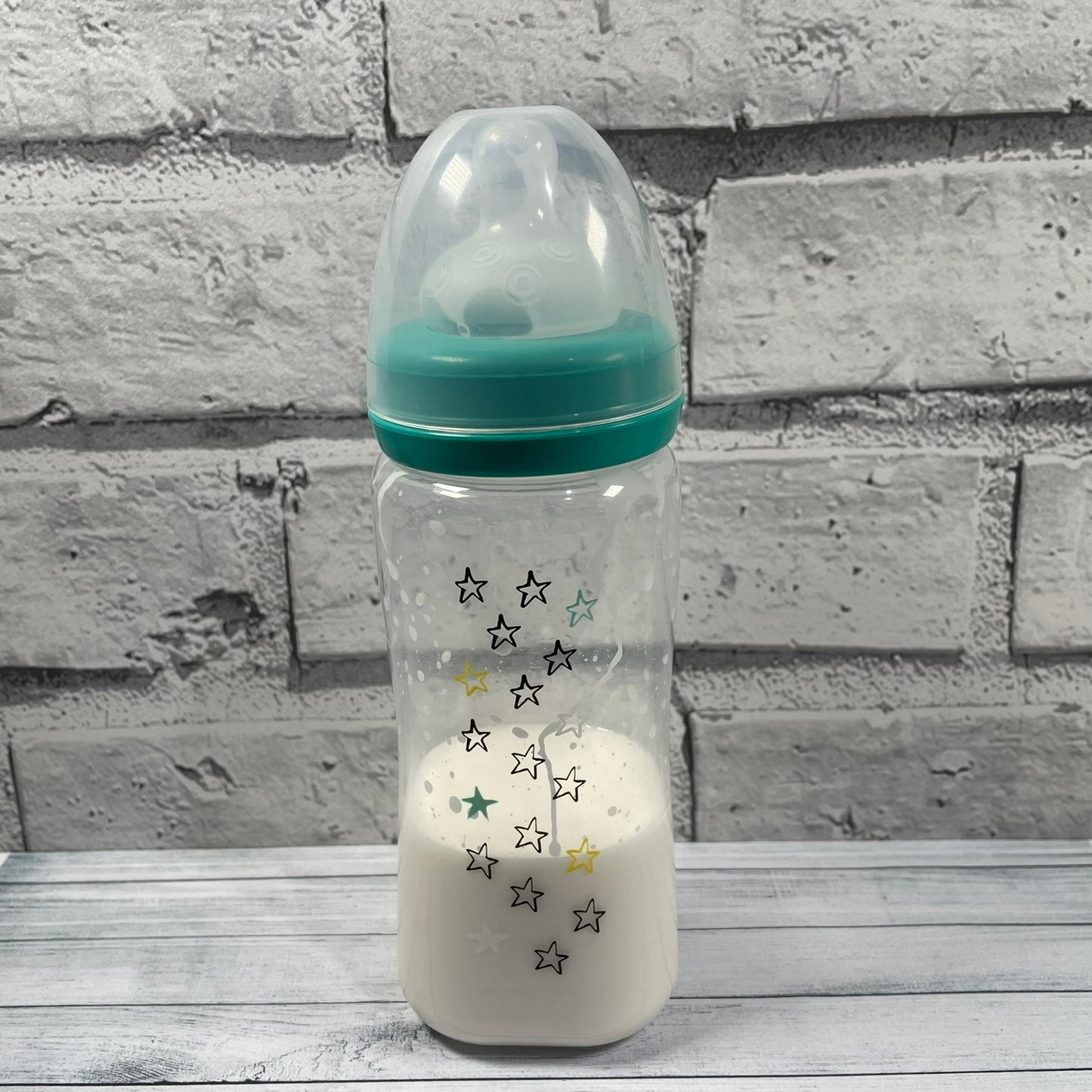 Green Stars Reborn Fake Milk Bottle 9oz
