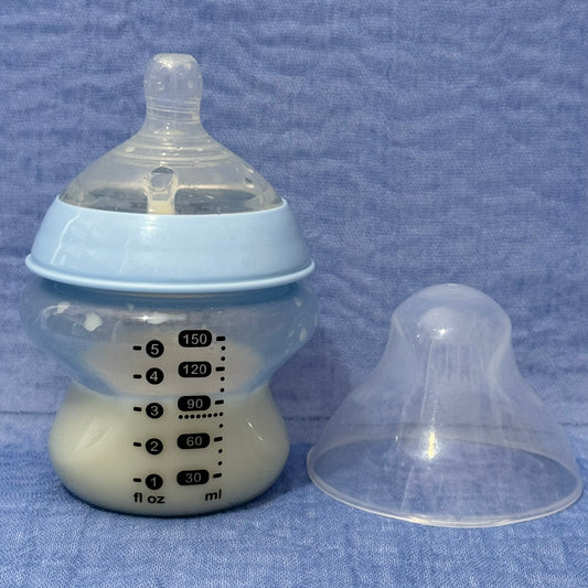 Baby bottle with nipple in pale blue