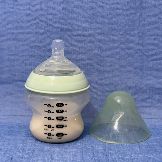 Baby bottle with nipple in pale green