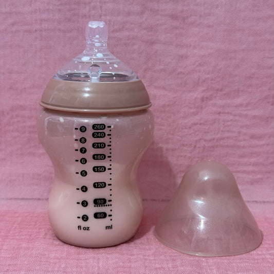Baby bottle with nipple in pink