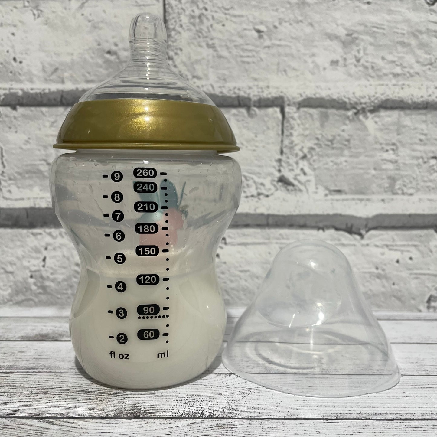 Tommee Tippee Gold Peaches Reborn Fake Milk Bottle 9oz