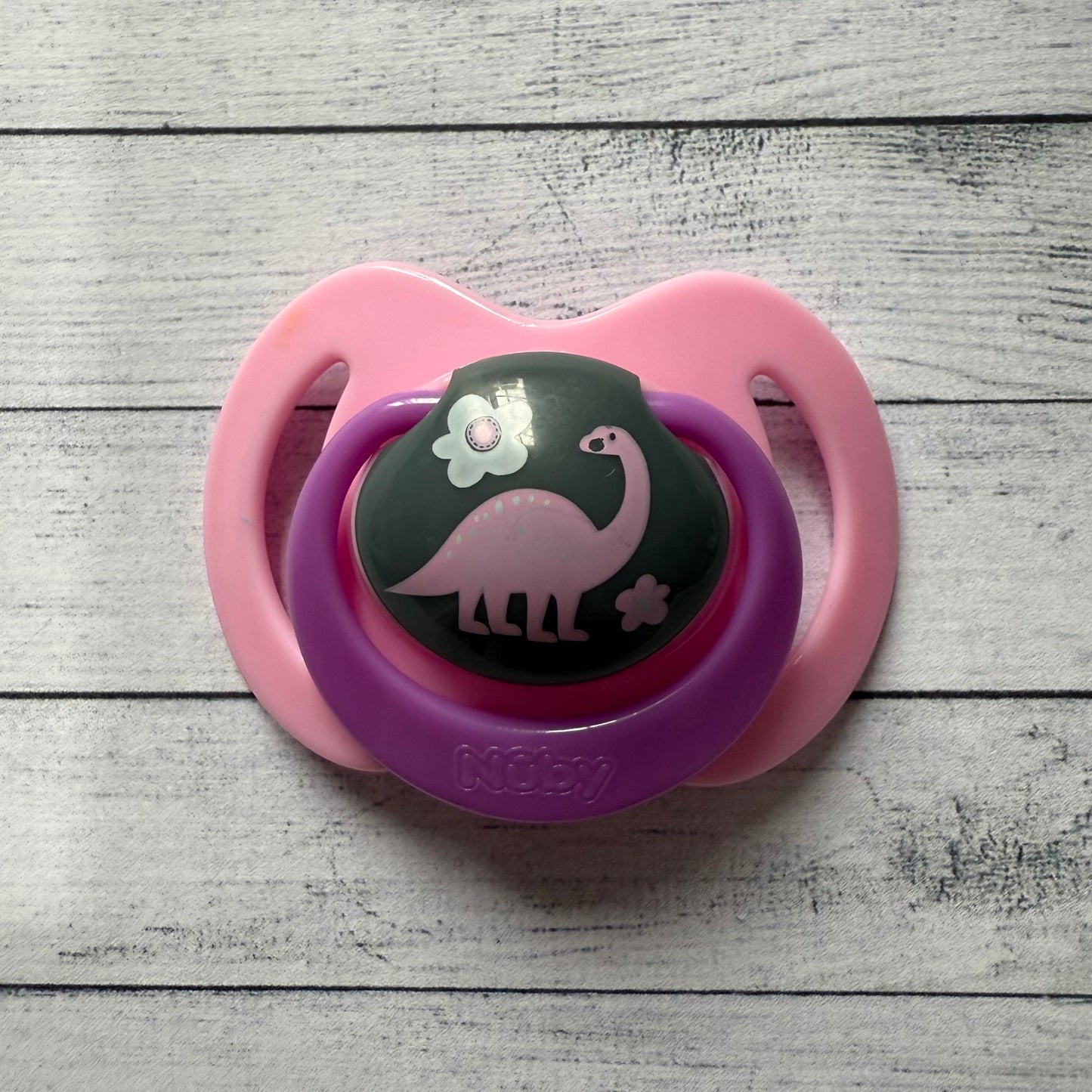 Nuby Pink Dinosaur Reborn Magnetic Dummy - self fit magnet