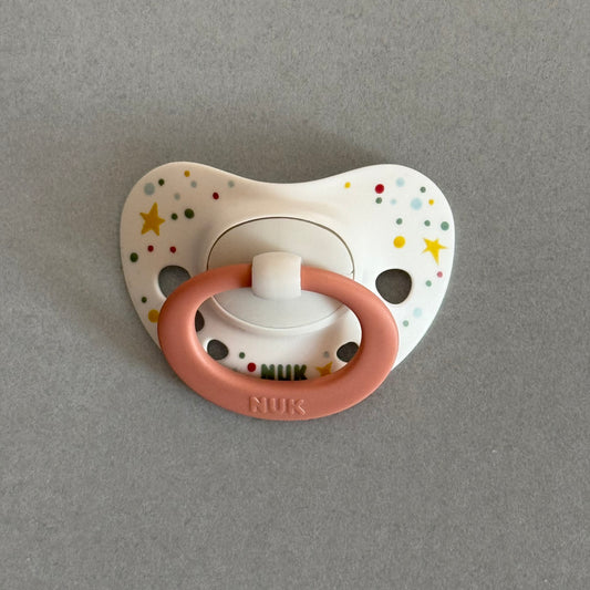NUK Dusky Pink Stars Reborn Magnetic Dummy - self fit magnet