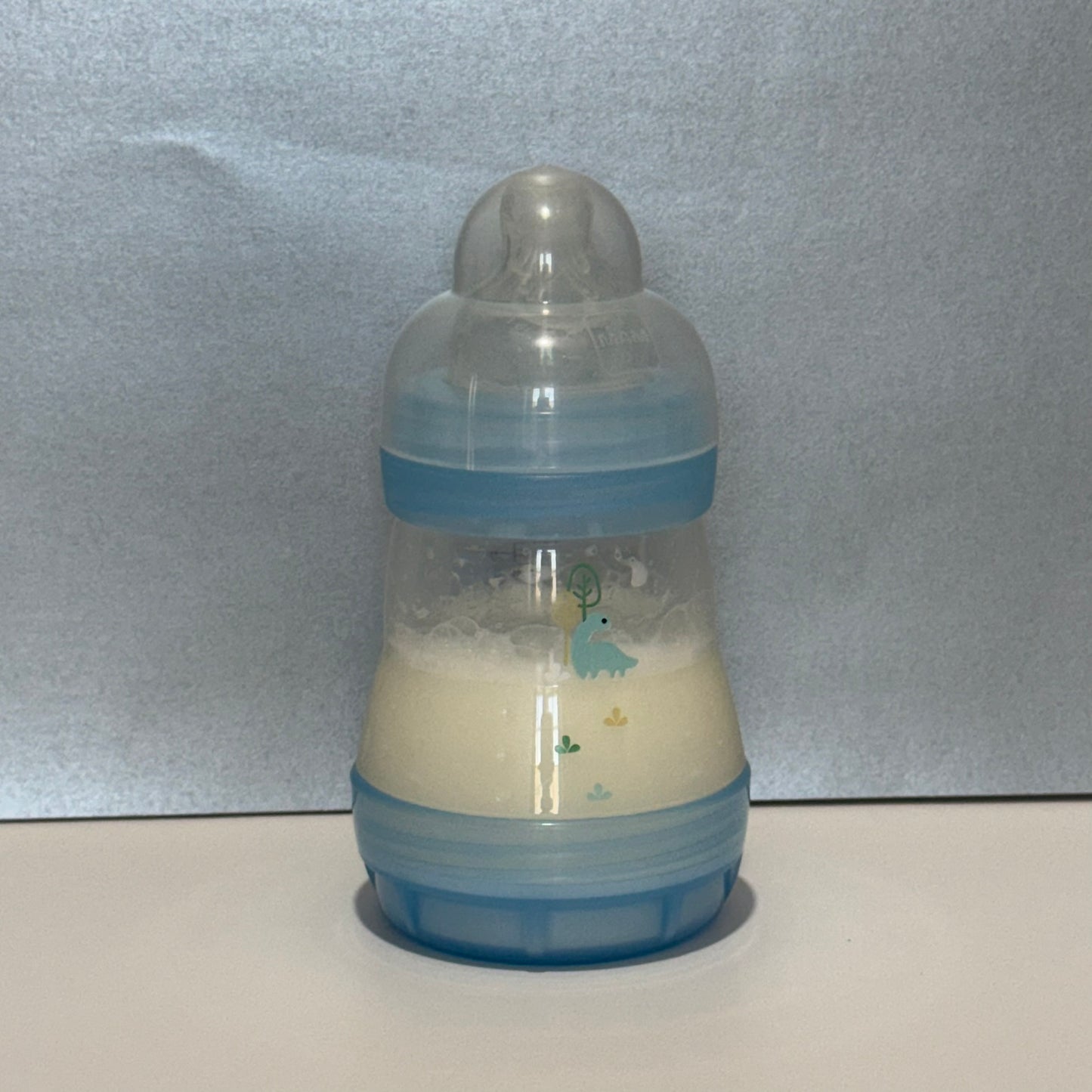 MAM Transparent Blue Dinosaur Reborn Fake Milk Bottle 5oz