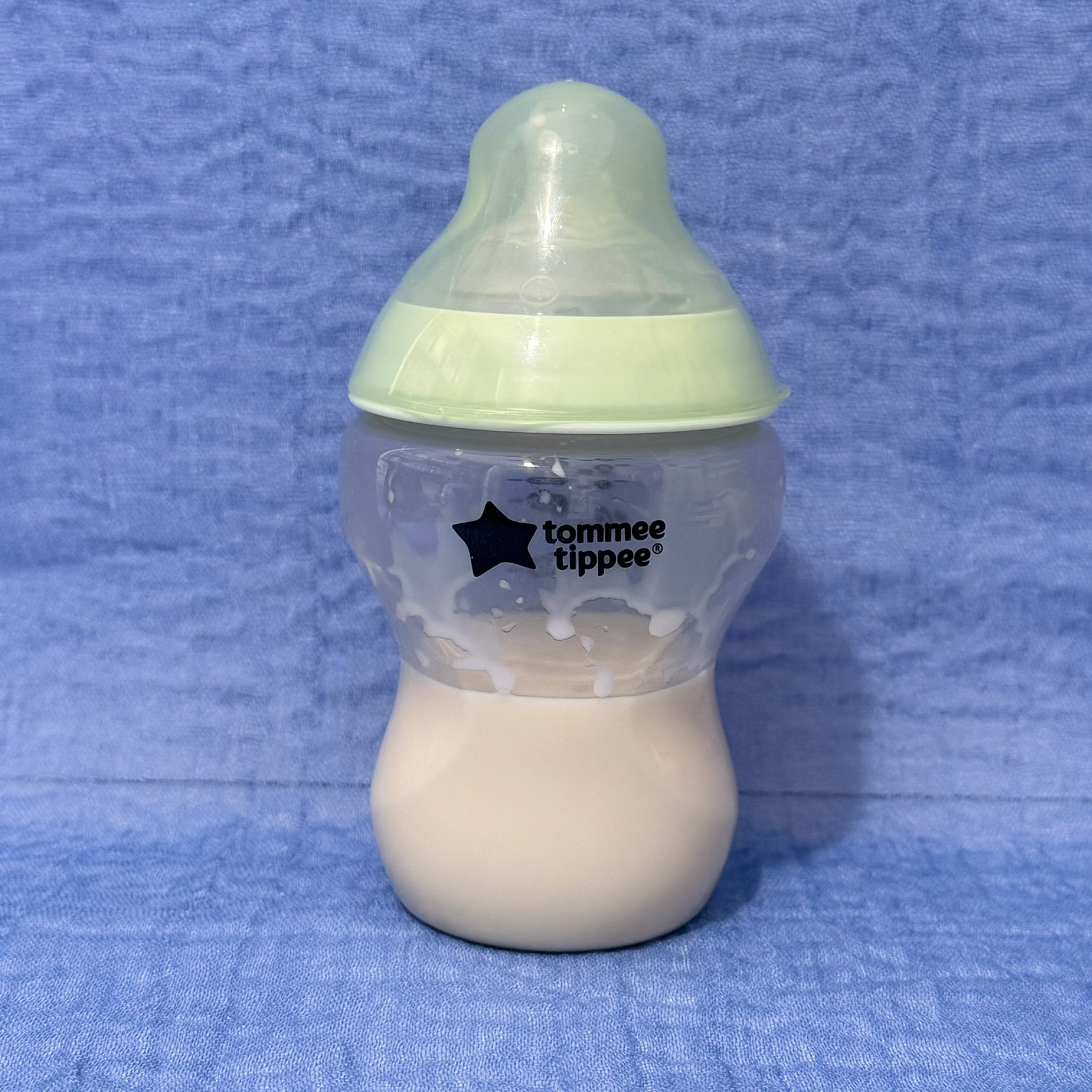 Tommee Tippee baby bottle with green cap