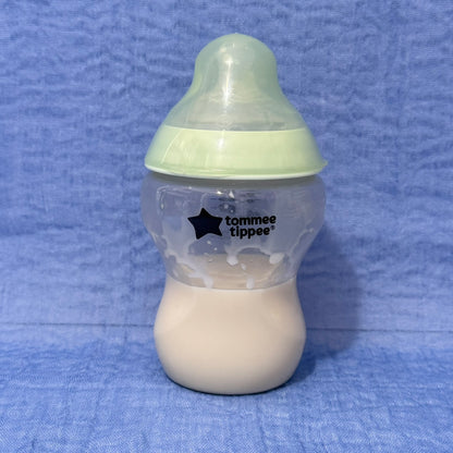 Tommee Tippee baby bottle with green cap